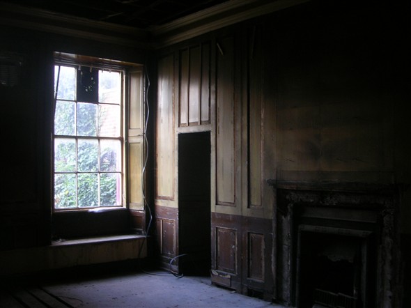 Photo:Ground floor with missing fireplace.